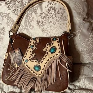 Medium size Montana West purse. NWT. ORIGINALLY 69.99 selling for $20